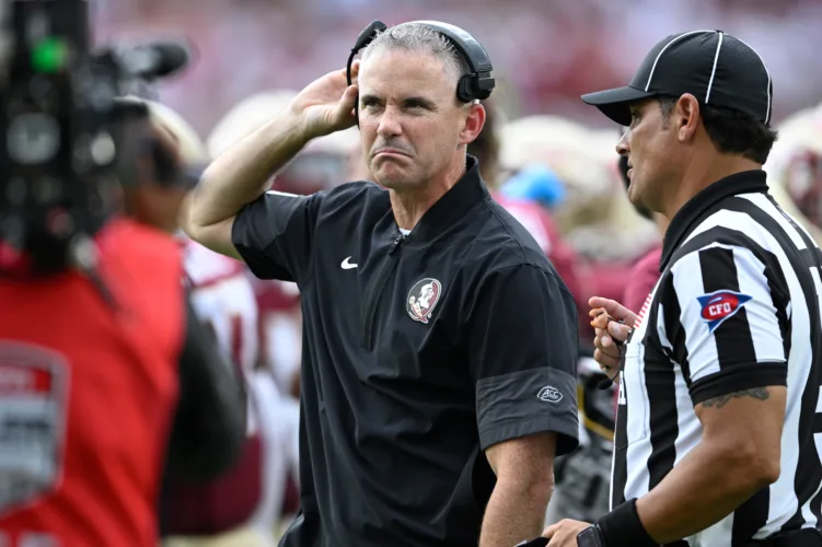 Half-dozen college football coaches in hot spotlight